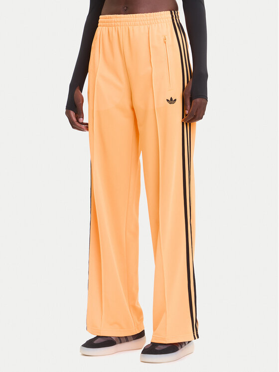 Снимка на adidas Долнище анцуг adicolor Classic Firebird JY2694 Жълт Loose Fit