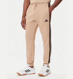Снимка на adidas Долнище анцуг Essentials 3-Stripes JX0712 Бежов Regular Fit